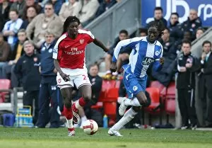 Images Dated 11th April 2009: Emmanuel Adebayor (Arsenal) Mario Melchiot (Wigan)