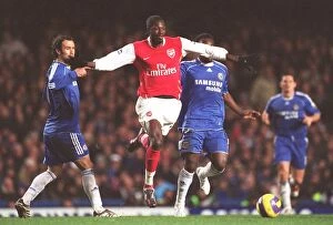 Images Dated 11th December 2006: Emmanuel Adebayor (Arsenal) Michael Essien (Chelsea)