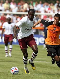 Emmanuel Adebayor (Arsenal) Michael Leary (Barnet) Emmanuel Adebayor (Arsenal) Michael Leary (Barnet)