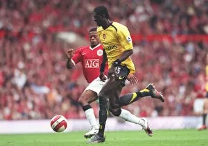 Manchester United v Arsenal 2006-7 Collection: Emmanuel Adebayor (Arsenal) Patrice Evra (Manchester United)