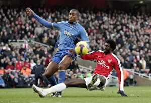 Emmanuel Adebayor (Arsenal) Sylvain Distin (Portsmouth)