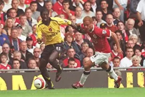 Manchester United v Arsenal 2006-7 Collection: Emmanuel Adebayor (Arsenal) Wes Brown (Manchester United)