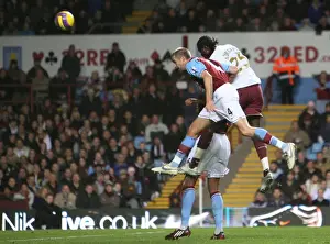 Aston Villa V Arsenal 2007-8 Prints: Emmanuel Adebayor beats Olof Mellberg to score the 2nd Arsenal goal