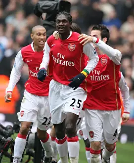 Emmanuel Adebayor celebrates scoring the 1st Arsenal goal with Cesc Fabregas