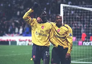 Emmanuel Adebayor celebrates scoring the 3rd goal with Julio Baptista