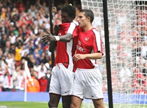 Emmanuel Adebayor celebrates scoring the Arsenal goal