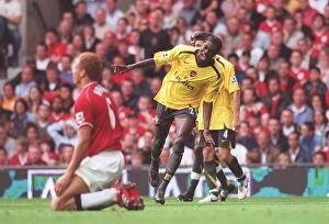 Manchester United v Arsenal 2006-7 Collection: Emmanuel Adebayor celebrates scoring the Arsenal goal