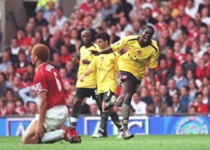 Manchester United v Arsenal 2006-7 Collection: Emmanuel Adebayor celebrates scoring the Arsenal goal