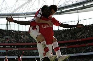 Emmanuel Adebayor celebrates scoring his and Arsenal s