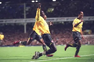 Emmanuel Adebayor celebrates scoring Arsenals goal with Armand Traore