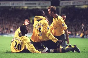 Emmanuel Adebayor celebrates scoring Arsenals goal with Johan Djourou
