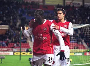 Emmanuel Adebayor celebrates scoring Arsenals goal with Robin van Persie