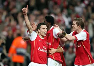 Emmanuel Adebayor celebrates scoring Arsenals goal with Robin van Persie