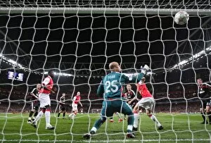 Emmanuel Adebayor heads past Liverpool Pepe Reina to scote the Arsenal goal