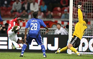 Emmanuel Adebayor heads past Maarten Stekelenburg to