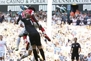 Images Dated 17th September 2007: Emmanuel Adebayor heads past Tottenham goalkeeper Paul Robinson to score the 1st Arsenal goal