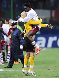 Emmanuel Adebayor and Manuel Almunia celebrate Arsenals victory