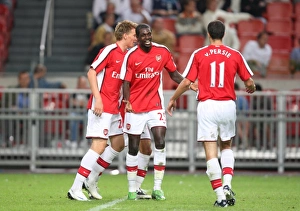 Emmanuel Adebayor and Robin van Persie celebrate Arsenal's Emmanuel Adebayor and Robin van Persie celebrate Arsenal's