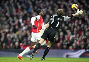 Arsenal v West Ham United 2007-8 Collection: Emmanuel Adebayor rounds Robert Green (West Ham) on his way to scoring Arsenals 2nd goal