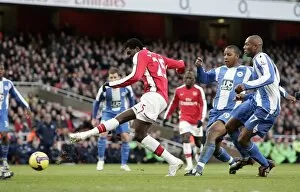 Emmanuel Adebayor scores Arsenals goal under pressure