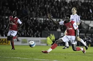 Derby County v Arsenal 2007-8 Collection: Emmanuel Adebayor shoots past Derby goalkeeper Roy Carroll to score his 2nd