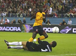 FC Twente V Arsenal Prints: Emmanuel Adebayor shoots past FC Twente goalkeeper