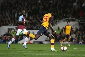 West Ham United v Arsenal 2008-09 Collection: Emmanuel Adebayor shoots past Herita Ilunga to score