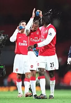 Emmanuel Adebayor squirts water at Thierry Henry (Arsenal) at the end of the match