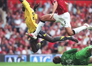 Emmanuel Adebayor is tripped by Manchester United goalkeeper Tomaz Kuszczak for the Arsenal penalty