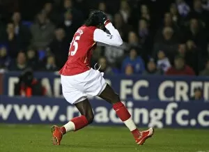 Emmanuel Adebayor watches as his shot hits the post
