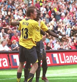 Images Dated 30th September 2006: Emmanuel Eboue and Alex Hleb (Arsenal) celebrate the 2nd Robin van Persie goal