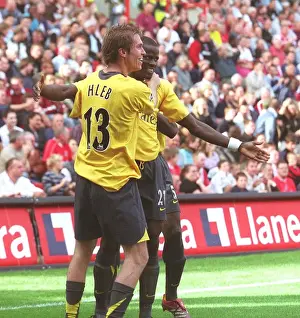 Emmanuel Eboue and Alex Hleb (Arsenal) celebrate the 2nd Robin van Persie goal