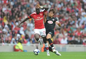 Arsenal V Athletico Madrid 2009-10 Prints: Emmanuel Eboue (Arsenal) Alvaro Dominguez (Athletico Madrid)