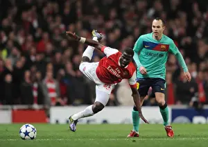 Arsenal V Barcelona 2010-11 Prints: Emmanuel Eboue (Arsenal) Andres Iniesta (Barcelona). Arsenal 2: 1 Barcelona
