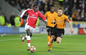 Images Dated 13th March 2010: Emmanuel Eboue (Arsenal) Andy Dawson (Hull). Hull City 1: 2 Arsenal, Barclays Premier League