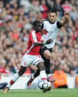 Images Dated 9th May 2010: Emmanuel Eboue (Arsenal) Clint Dempsey (Fulham). Arsenal 4: 0 Fulham, Barclays Premier League