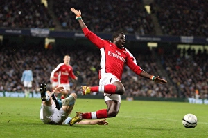Manchester City v Arsenal - Carling Cup 2009-10 Collection: Emmanuel Eboue (Arsenal) Craig Bellamy (Man City). Manchester City 3: 0 Arsenal