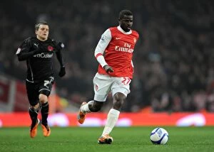 Emmanuel Eboue (Arsenal) Dean Cox (Orient). Arsenal 5: 0 Leyton Orient. FA Cup 5th Round Replay