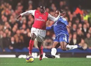 Images Dated 11th December 2006: Emmanuel Eboue (Arsenal) Didier Drogba (Chelsea)