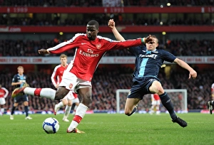 Arsenal v West Ham United 2009-10 Collection: Emmanuel Eboue (Arsenal) Fabio Daprela (West Ham). Arsenal 2: 0 West Ham United