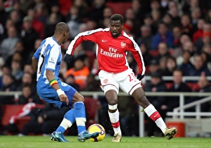 Images Dated 6th December 2008: Emmanuel Eboue (Arsenal) Henri Camara (Wigan)