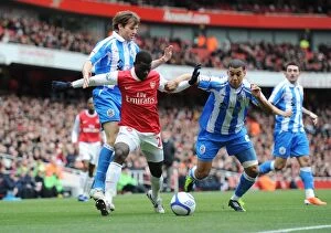 Images Dated 30th January 2011: Emmanuel Eboue (Arsenal) Lee Peltier and Kevin Kilbane (Huddersfield). Arsenal 2