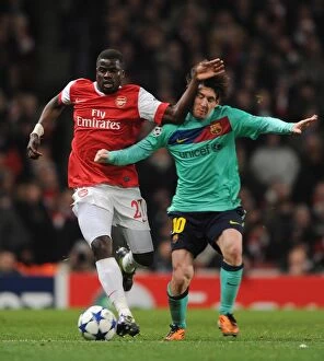 Images Dated 16th February 2011: Emmanuel Eboue (Arsenal) Lionel Messi (Barcelona). Arsenal 2: 1 Barcelona