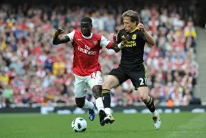 Arsenal v Liverpool 2010-2011 Collection: Emmanuel Eboue (Arsenal) Lucas Leiva (Liverpool). Arsenal 1: 1 Liverpool