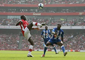 Arsenal V Wigan Athletic 2009-10 Prints: Emmanuel Eboue (Arsenal) Maynor Figueroa (Wigan)
