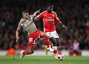 Images Dated 24th November 2009: Emmanuel Eboue (Arsenal) Medhi Carcela-Gonzalez (Liege)