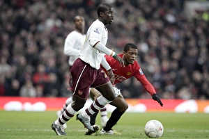 Manchester United V Arsenal FA Cup Prints: Emmanuel Eboue (Arsenal) Patrice Evra (Man Utd)