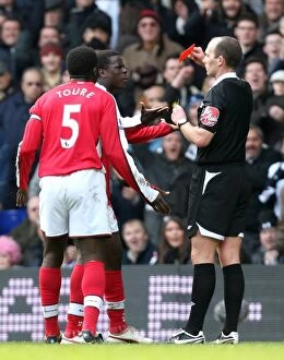 Images Dated 8th February 2009: Emmanuel Eboue (Arsenal) is shown the Red Card by referee Mike Dean