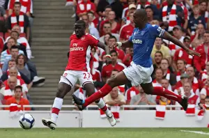 Arsenal V Portsmouth 2009-10 Prints: Emmanuel Eboue (Arsenal) Sylvain Distin (Portsmouth)