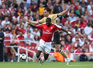 Arsenal V Juventus Prints: Emmanuel Eboue (Arsenal) Tiago (Juve)